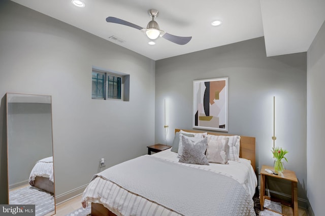 bedroom with hardwood / wood-style flooring and ceiling fan