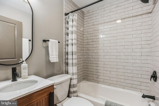 full bathroom featuring shower / tub combo, vanity, and toilet