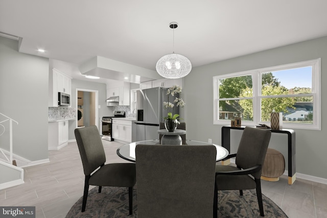 dining area with a chandelier