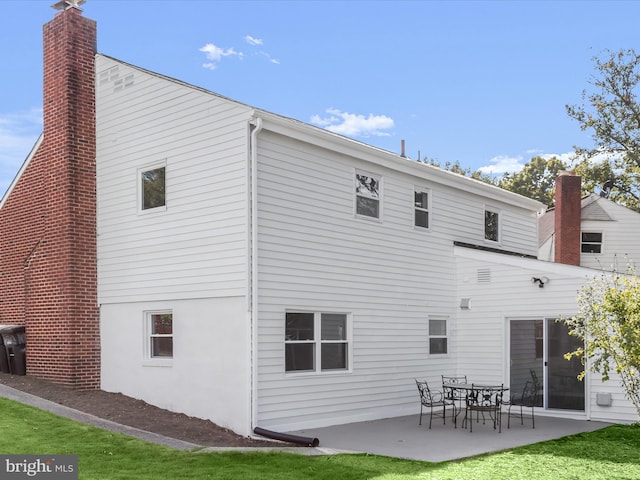 back of property featuring a patio