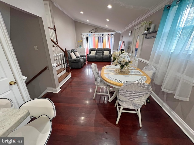 dining area with crown molding, plenty of natural light, dark hardwood / wood-style floors, and lofted ceiling