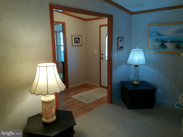 interior space with ornamental molding and hardwood / wood-style flooring