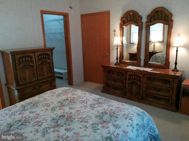 bedroom featuring light carpet