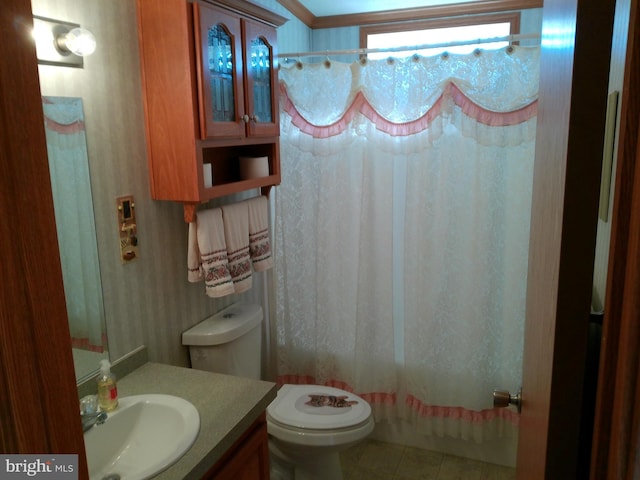 bathroom featuring crown molding, tile patterned flooring, vanity, and toilet