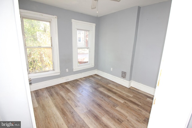 spare room with ceiling fan and light hardwood / wood-style floors