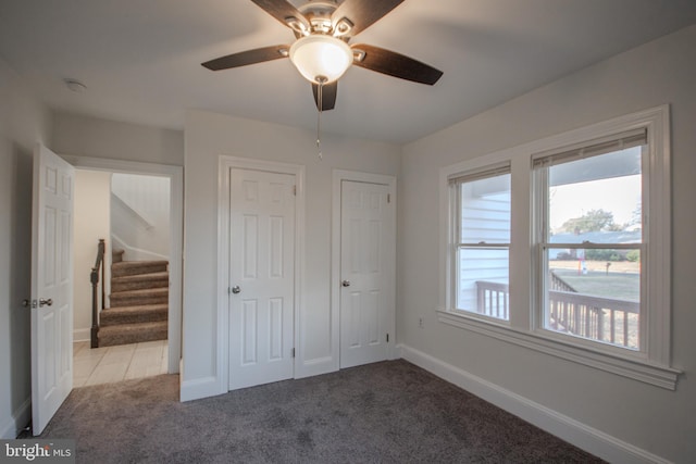 unfurnished bedroom with light carpet and ceiling fan