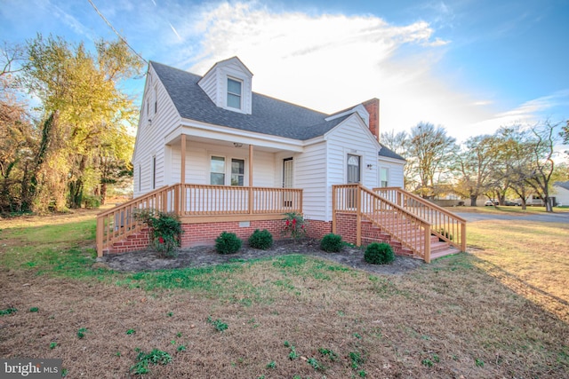 view of front facade with a porch and a front yard