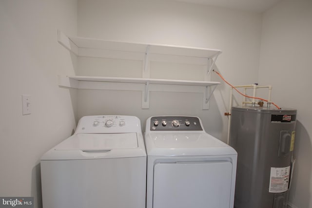 washroom featuring washing machine and dryer and water heater