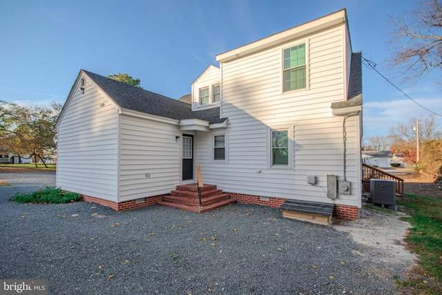 rear view of property featuring central air condition unit