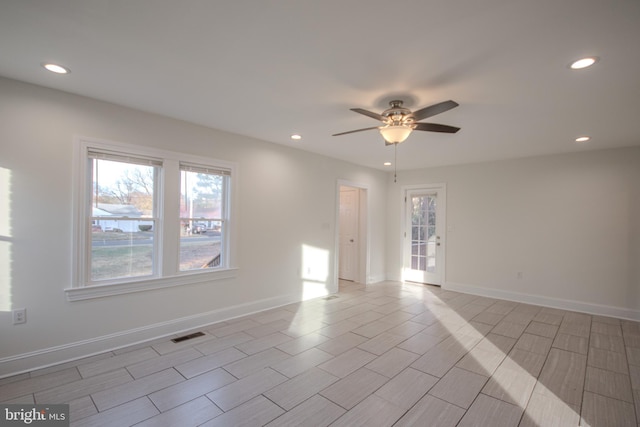 unfurnished room with ceiling fan