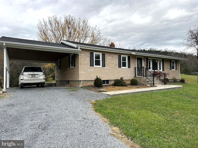 ranch-style house featuring a carport and a front lawn