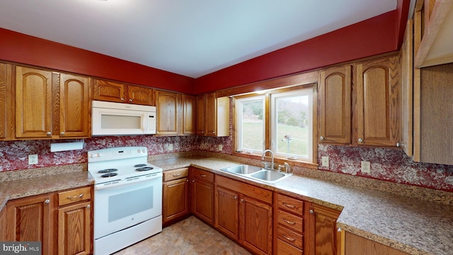 kitchen featuring sink and white appliances