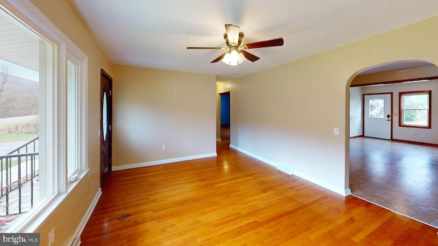 spare room with ceiling fan and hardwood / wood-style flooring