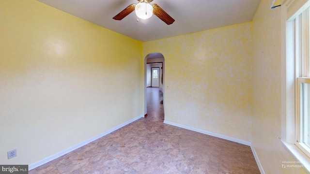 unfurnished room featuring ceiling fan