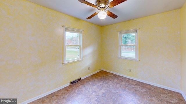 spare room with ceiling fan