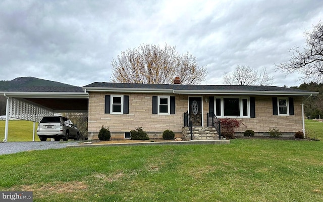 single story home with a carport and a front lawn