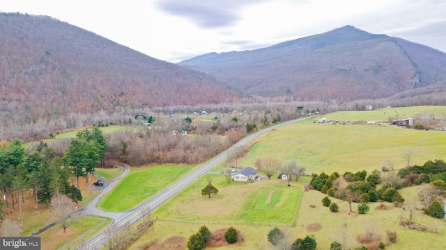 birds eye view of property featuring a mountain view and a rural view