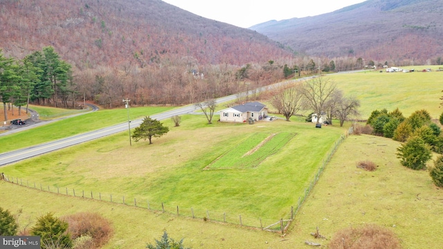 drone / aerial view featuring a mountain view and a rural view