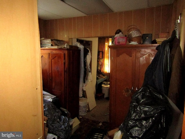 bedroom with wood walls