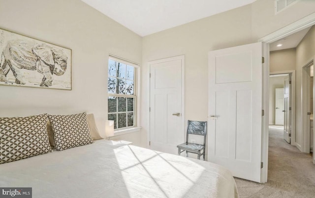 bedroom with light colored carpet