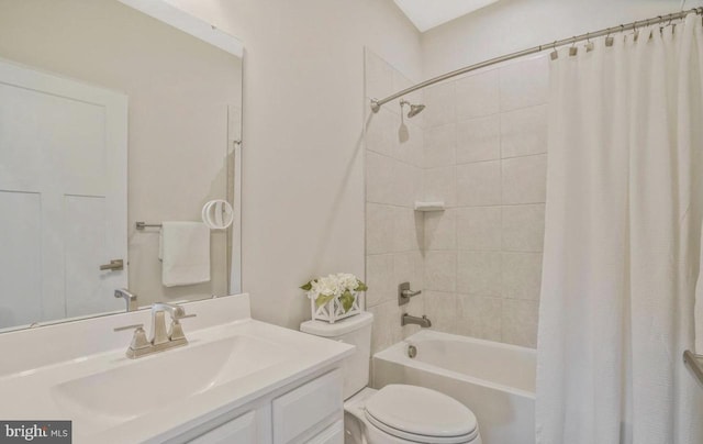 full bathroom with shower / tub combo, vanity, and toilet