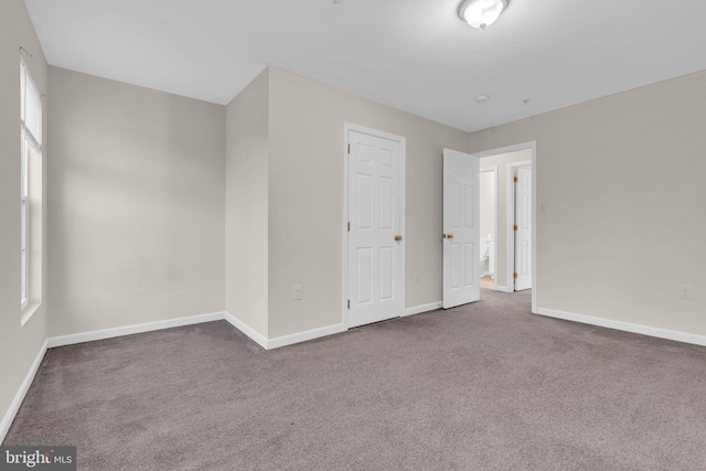 spare room with carpet flooring