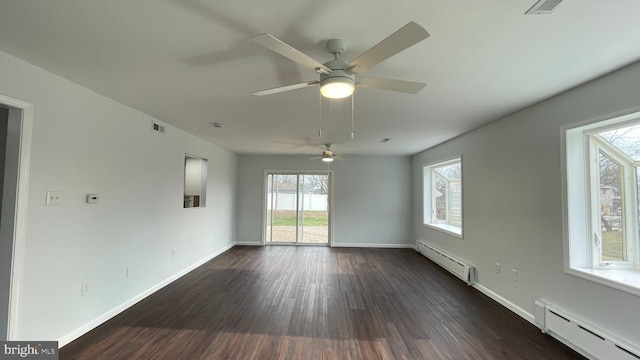 empty room with baseboard heating, dark wood-type flooring, and ceiling fan