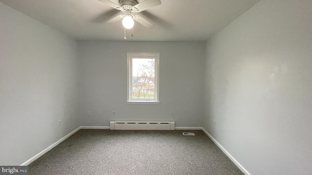 carpeted empty room with a baseboard radiator and ceiling fan