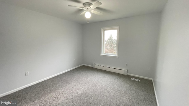 empty room with baseboard heating, ceiling fan, and carpet