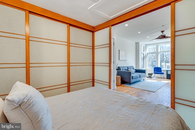 bedroom featuring attic access and recessed lighting