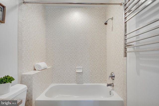 bathroom with toilet and  shower combination