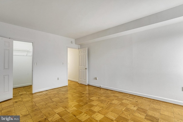 spare room featuring light parquet floors