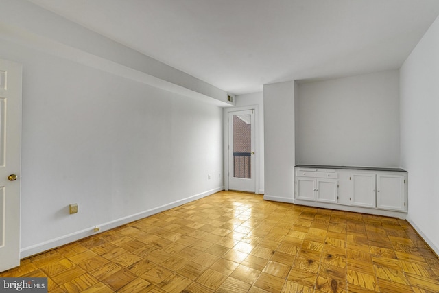 spare room with light parquet flooring