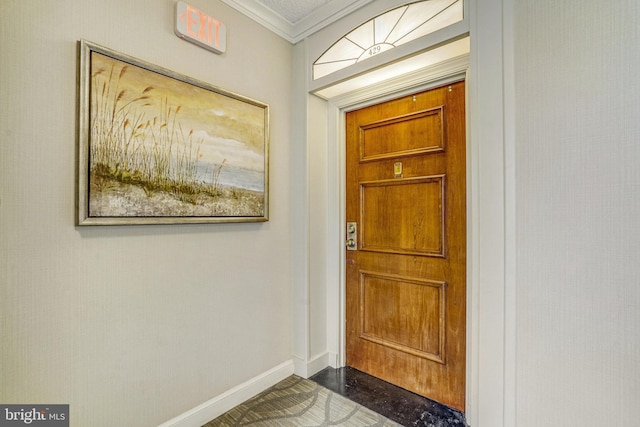 foyer featuring crown molding