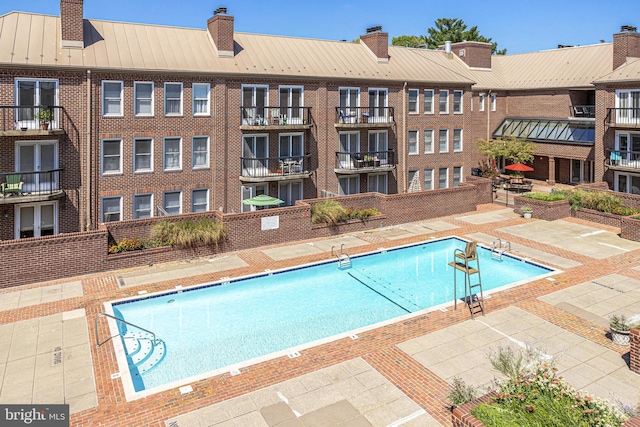 view of swimming pool with a patio