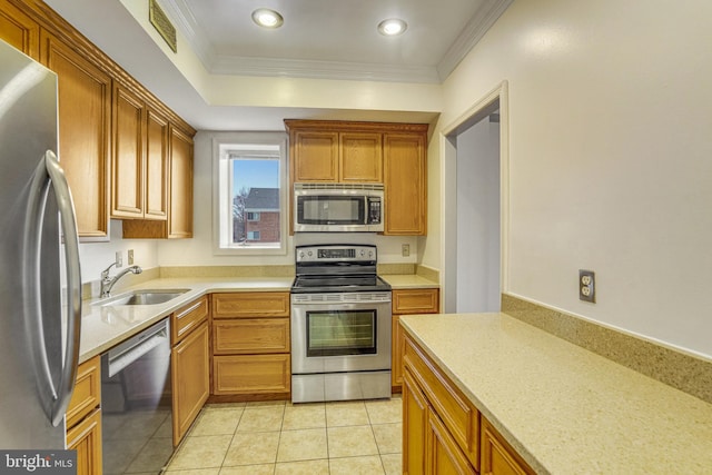 kitchen featuring light tile patterned floors, stainless steel appliances, ornamental molding, and sink