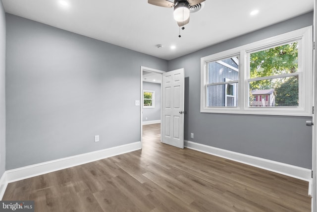 spare room featuring ceiling fan and hardwood / wood-style floors