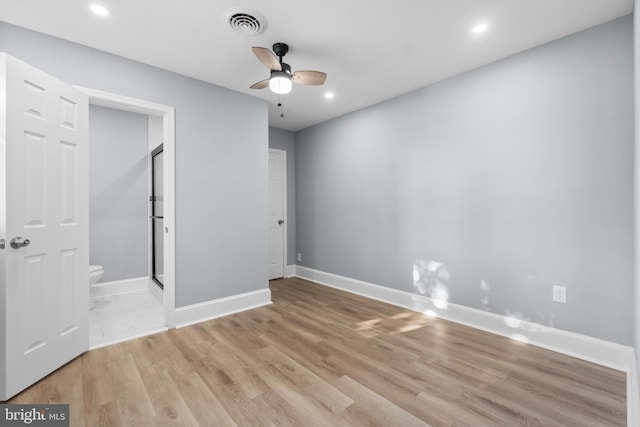 empty room with ceiling fan and light wood-type flooring