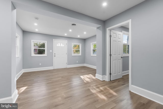 entryway with a healthy amount of sunlight and light hardwood / wood-style floors