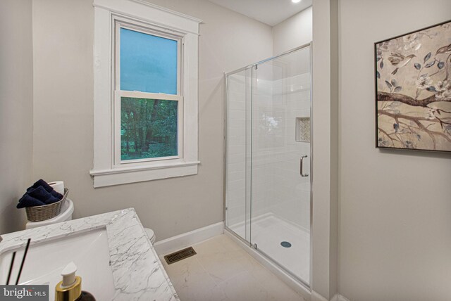 bathroom with vanity and an enclosed shower