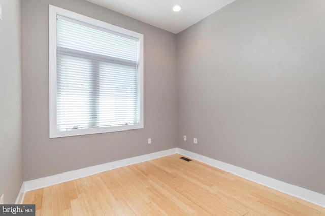 spare room featuring hardwood / wood-style flooring