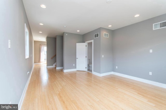 spare room featuring light hardwood / wood-style floors