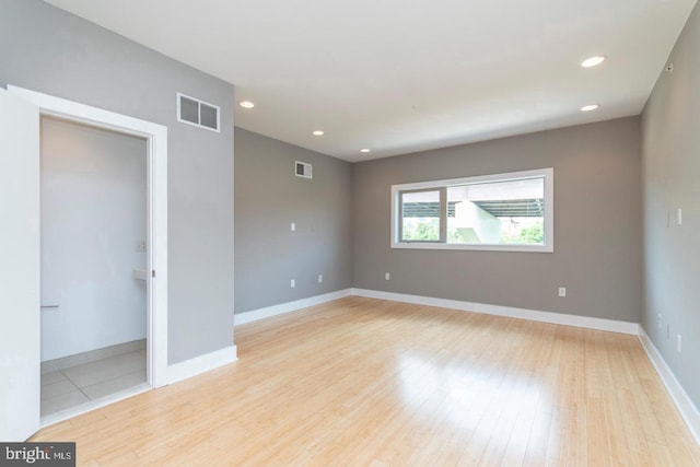 unfurnished room featuring light hardwood / wood-style floors