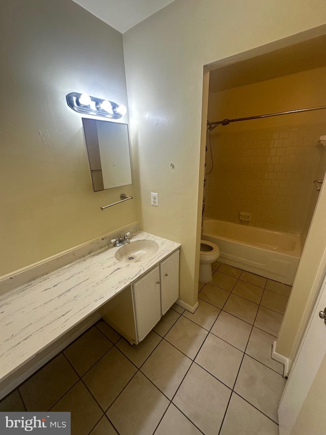 full bathroom with tile patterned flooring, vanity, toilet, and tiled shower / bath