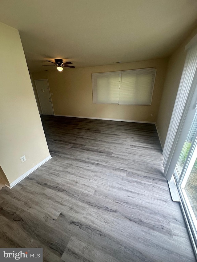 empty room featuring ceiling fan and light wood-type flooring