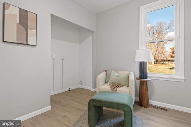 living area featuring light hardwood / wood-style floors