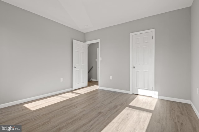 unfurnished bedroom featuring light hardwood / wood-style floors