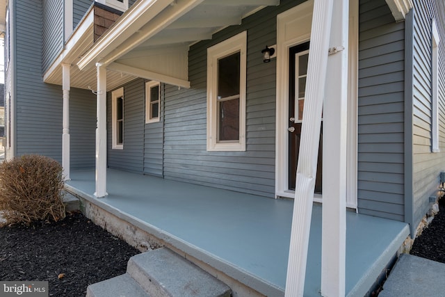 property entrance featuring covered porch