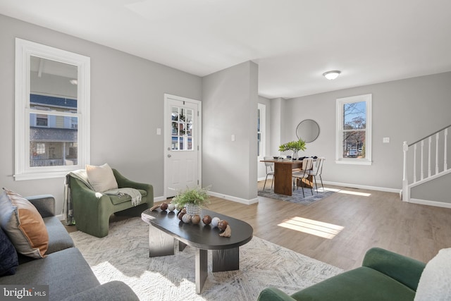 living room with light hardwood / wood-style flooring