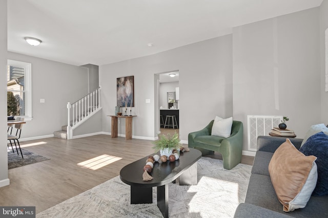 living room with light hardwood / wood-style floors